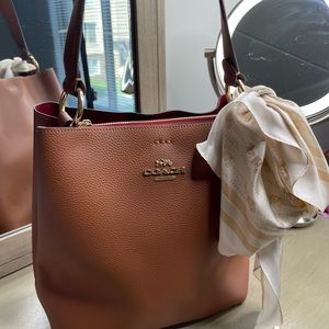 Brown Coach Crossbody with Cream accent scarf